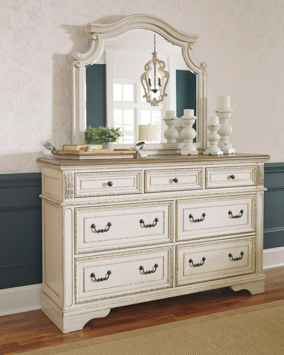 Realyn  Upholstered Panel Bed With Mirrored Dresser And Chest